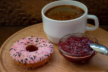 Morning coffee with donut and jam