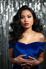 Fototapeta premium Alluring glamour asian woman with sensual look posing to a camera. 