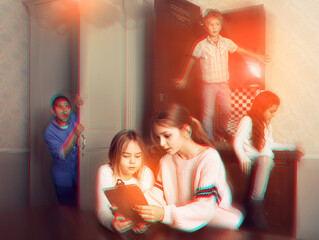 Two interested preteen girls trying to find solution of riddles in quest room, toned image