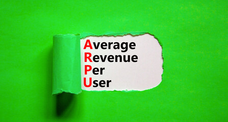 ARPU average revenue per user symbol. Concept words ARPU average revenue per user on white paper on beautiful green background. Business ARPU average revenue per user concept. Copy space.