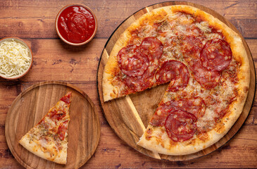 Food photography of pizza, salami, mozzarella, cheese, tomato, sauce, oregano, spicy 