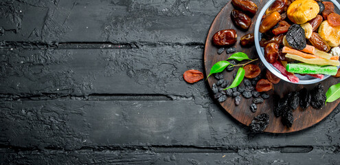 Different dried fruit in a bowl.