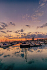 Fototapeta na wymiar sunset in the port of Alicante, Spain with yachts