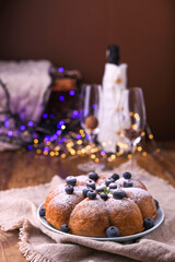 Christmas timChristmas time in Italian tradition. Biscuit holiday cake with berries on the table in Italian tradition. Biscuit birthday cake with berries on the table. 