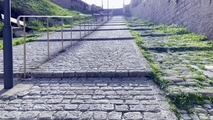 Bonifacio (Corsica, France), France - October 27 2022 : Walking on very large stone steps from the pedestrian street of the Climb Saint Roch.