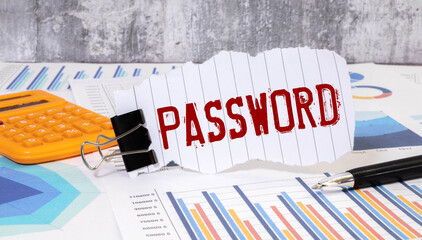 The word password written on a sticky note paper on computer keyboard. Password management