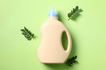 Hypoallergenic, organic baby laundry detergent packing design with green leaves on green background.