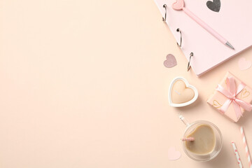 Valentine's Day flat lay: hearts, gift boxes, candle, coffee cup, photo album. Perfect for cards, social media, website banners.