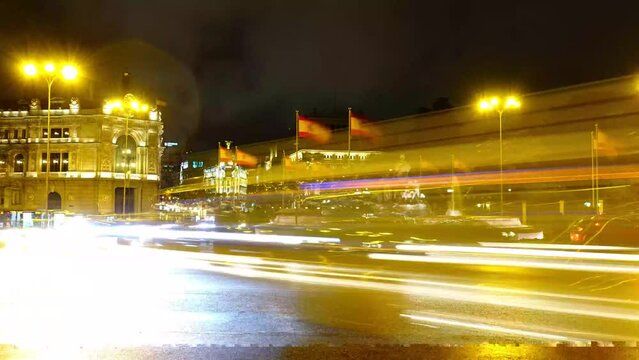 Cibeles fountain in Madrid. Night traffic in Madrid.