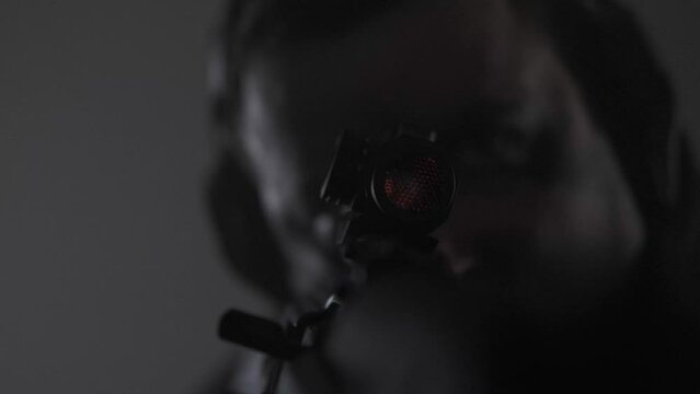 The shooter's face. Collimator. Concentration. Glasses. Headphones.