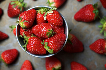 Overhead view of strawberries in bowl on table