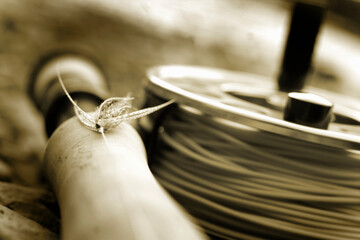 Close-up of fly fishing reel and steelhead fly taken along the Deschutes River in eastern Oregon.