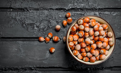 Hazelnuts in the bowl .
