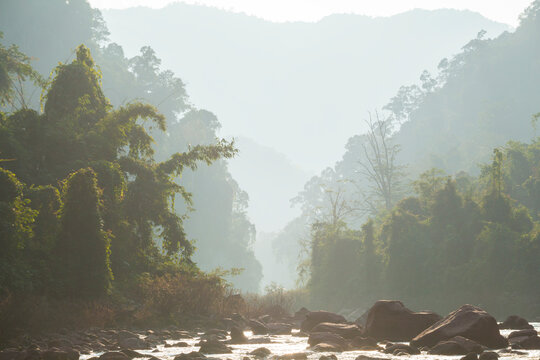 Sunset over boulder rapids on Nam Ou River in Phou Den Din National Protected Area, Laos