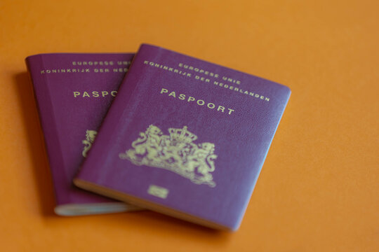 Traveling document and immigration concept, Selective focus of Dutch passport (Nederlands paspoort) are issued to citizens of the Kingdom of the Netherlands for the purpose of international travel. 