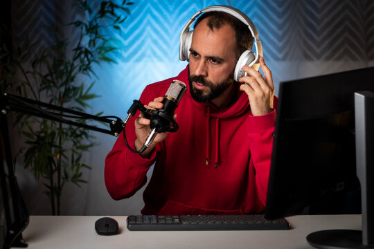 Content creator with headphones and microphone streaming