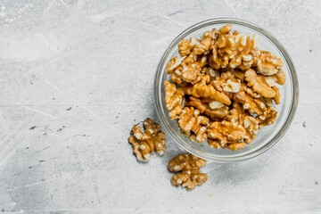 Walnuts in a glass bowl .