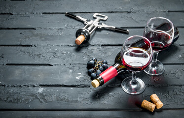 Red wine with corkscrew.