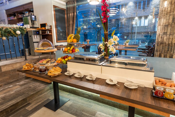 Restaurant interior with food buffet table