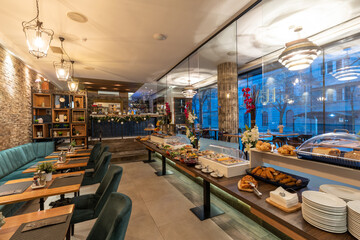 Restaurant interior with food buffet table