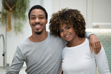 Joyful African American Husband Hugging Wife At Home