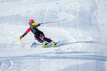 People are having fun in downhill skiing and snowboarding