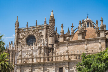 Fototapeta na wymiar Detail of the Cathedral of Santa Maria da Sede with dome and rose window in Gothic style, Seville SPAIN