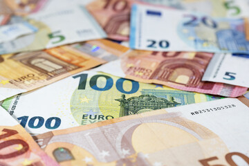 Different euro banknotes, money concept for economy, business and finance, close up with copy space, selected focus