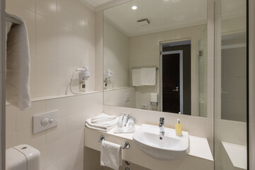 Fototapeta na wymiar Bathroom interior with glass shower cabin