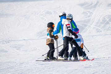 People are having fun in downhill skiing and snowboarding	