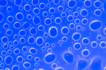 Indigo background with circles. Bubbles blue background.Indigo pattern with white circles. Macro round bubbles texture in blue tones.macro Bubbles set. 