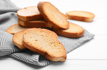Tasty hard chuck crackers on white wooden table
