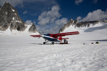 plane on a glacier in the alaskan mountains