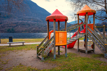 children playgrounds wintertime, on the mergozzo lake shores. is a glacial origin lake, close to the biggest maggiore lake, in piedmont region (northern italy).