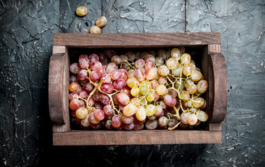 Pink grapes in the box.