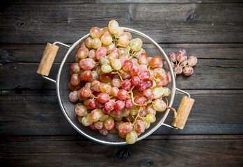 White grapes in a saucepan.