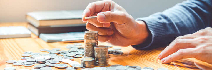 Saving money concept Man hand putting Row and coin Write Finance Saving money concept Man hand...