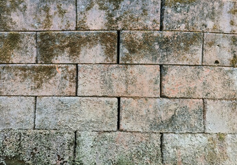 Brick wall with red bricks, brown brick background.