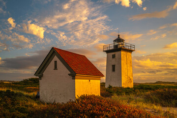 Wood End Lighthouse in Provincetown on Cape Cod, Massachusetts, USA, oceanside beach seascape at...