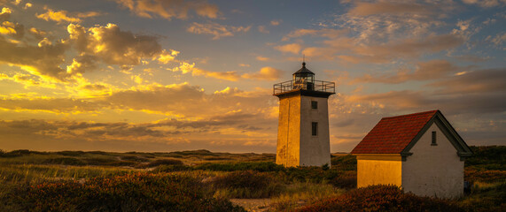 Wood End Lighthouse in Provincetown on Cape Cod, Massachusetts, USA, oceanside beach seascape at...