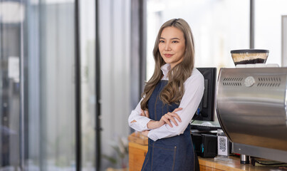 Opening a small business, A Happy Asian woman in an apron standing near a bar counter coffee shop, Small business owner, restaurant, barista, cafe, Online, SME, entrepreneur, and seller concept