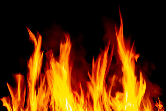 The flames of a fire burn against a black background