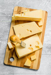 Fresh cheese on the chopping Board.