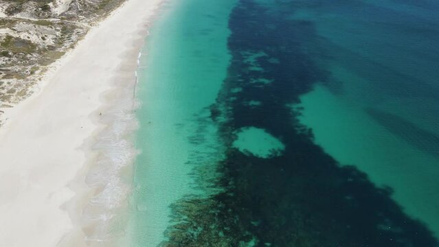 Aerial footage of Mindarie Beach showing off the clear ocean water and white sands of Perth Western Australia
