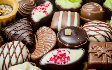 Chocolate candies with nuts and various fillings.