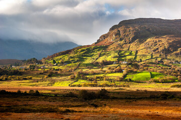 Green farmland fields in the Connemara hills, Ireland