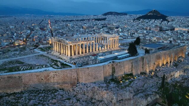Night view of ancient acropolis in Athens, classic Greek architecture, famous landmark in the capital of Greece, iconic view of the city of Athens. High quality 4k footage