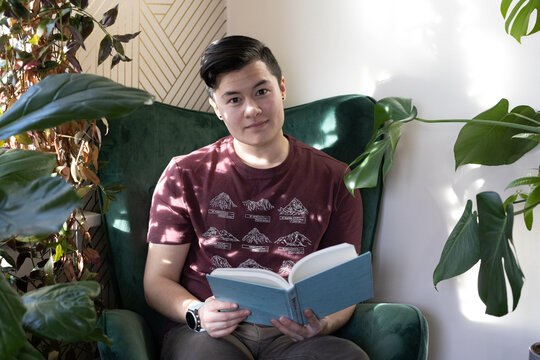 trans man reading a book