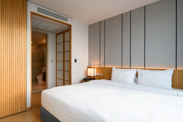 Warm and cozy interior of bedding room space with bed. Cozy home decor.