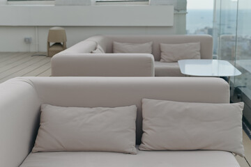 Grey sofa in modern hotel of a rooftop